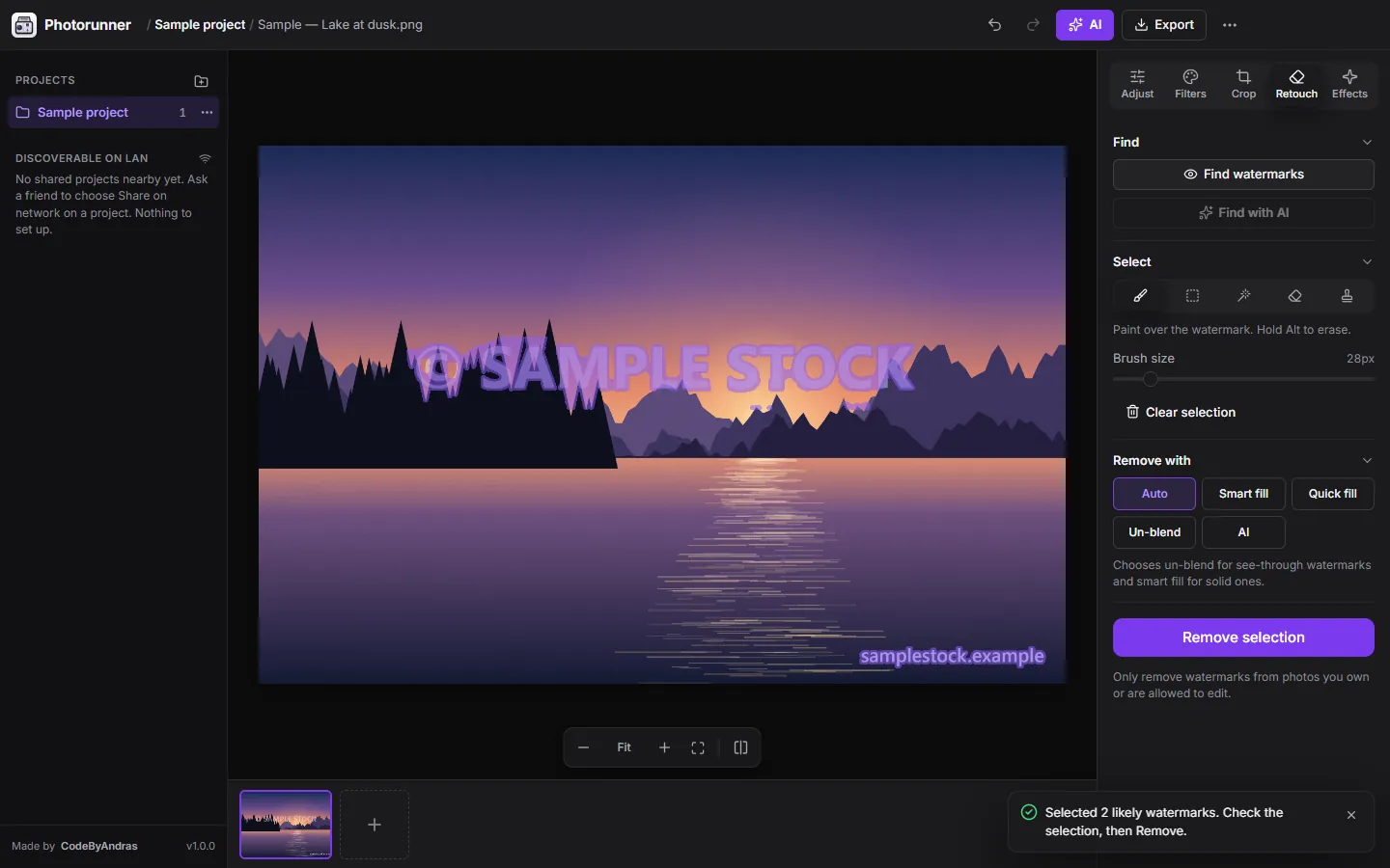 The Retouch tool has selected a semi-transparent watermark